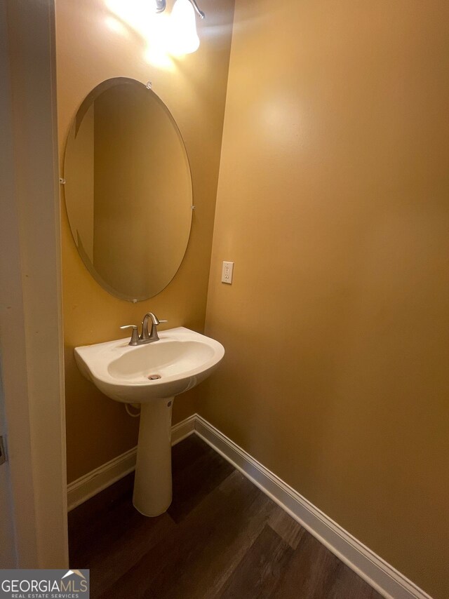5928 Cobblestone Creek Cir, Mableton, GA 30126 - bathroom featuring baseboards and wood finished floors