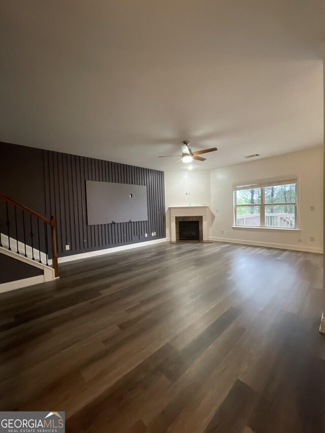 5928 Cobblestone Creek Cir, Mableton, GA 30126 - unfurnished living room featuring ceiling fan, baseboards, wood finished floors, and a fireplace