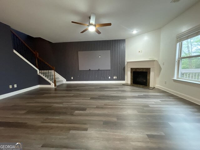 5928 Cobblestone Creek Cir, Mableton, GA 30126 - unfurnished living room with an accent wall, ceiling fan, wood finished floors, and stairway