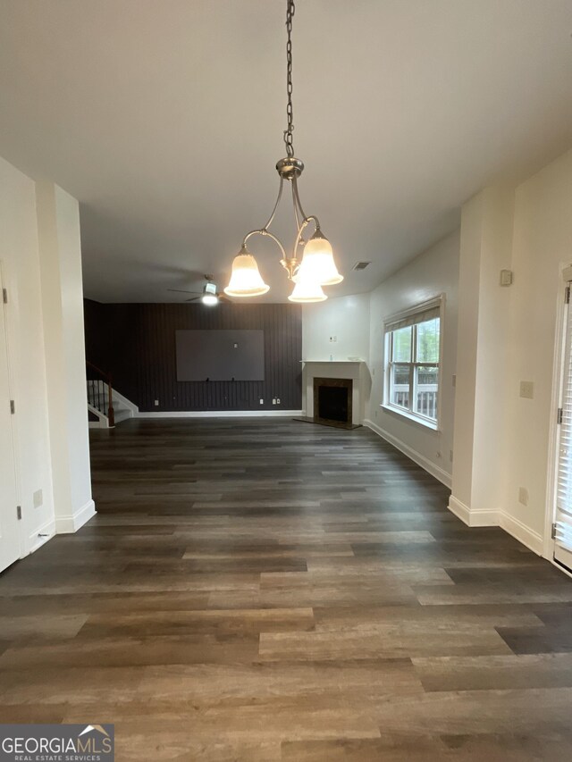 5928 Cobblestone Creek Cir, Mableton, GA 30126 - unfurnished living room featuring stairway, a notable chandelier, wood finished floors, and a fireplace