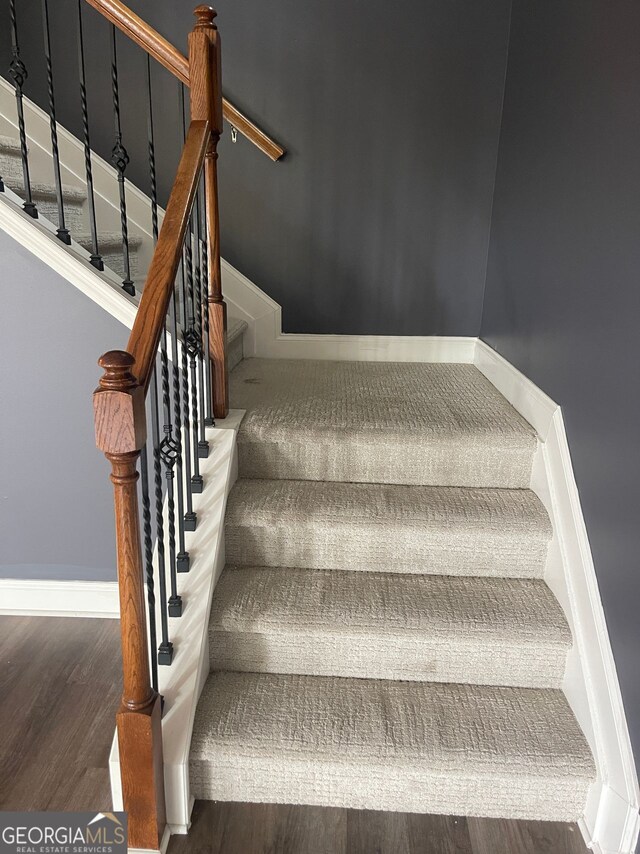 5928 Cobblestone Creek Cir, Mableton, GA 30126 - stairway featuring wood finished floors and baseboards