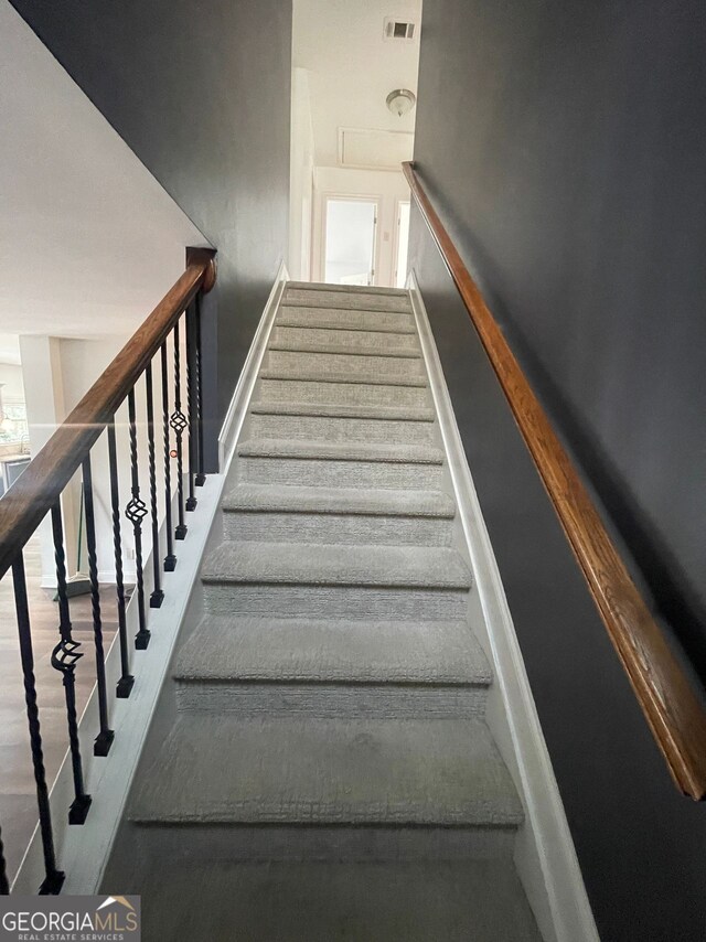 5928 Cobblestone Creek Cir, Mableton, GA 30126 - stairs featuring visible vents and wood finished floors