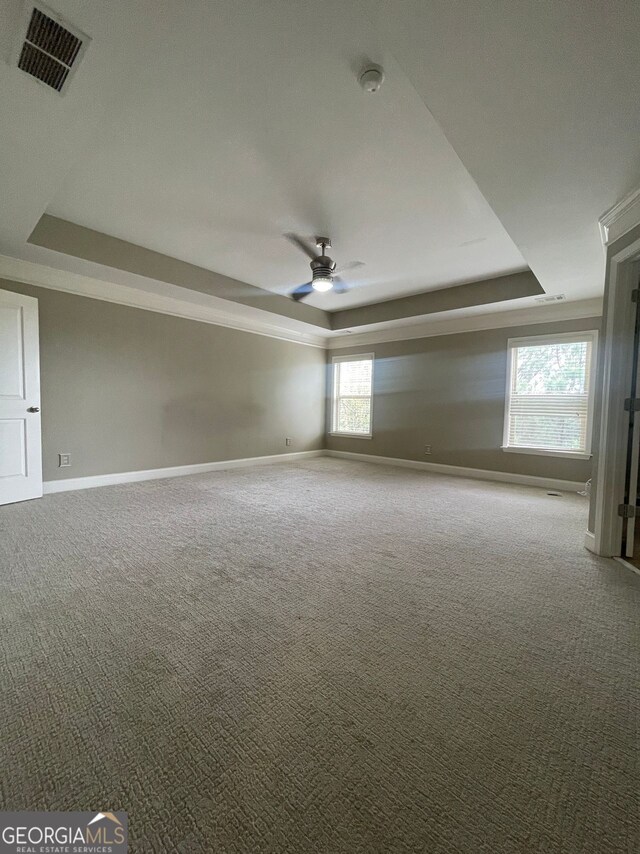 5928 Cobblestone Creek Cir, Mableton, GA 30126 - carpeted empty room with a tray ceiling, baseboards, a ceiling fan, and visible vents