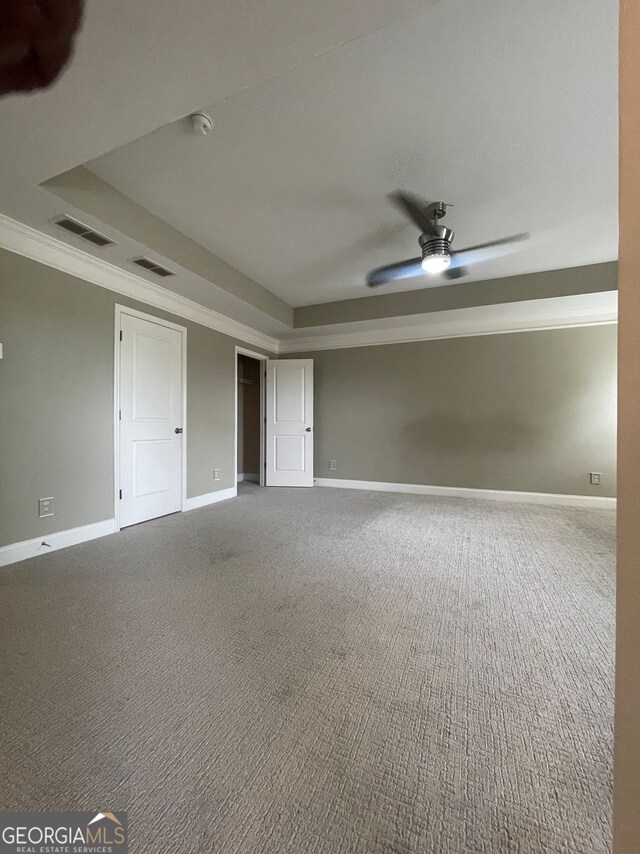 5928 Cobblestone Creek Cir, Mableton, GA 30126 - unfurnished room with carpet, ceiling fan, baseboards, and a raised ceiling