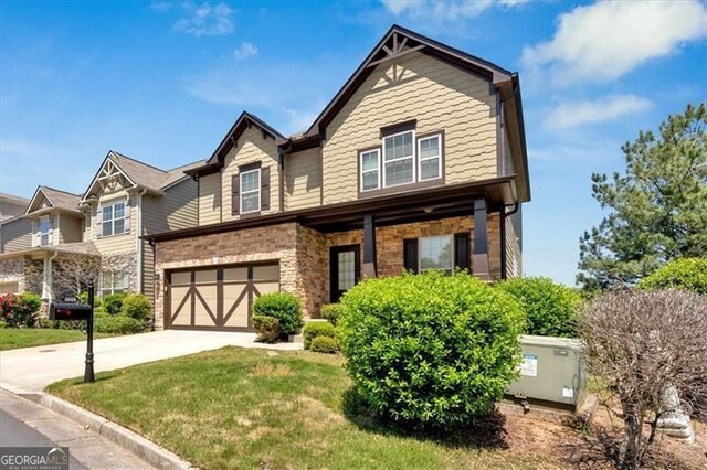 5928 Cobblestone Creek Cir, Mableton, GA 30126 - view of front of house with an attached garage, a front lawn, and concrete driveway