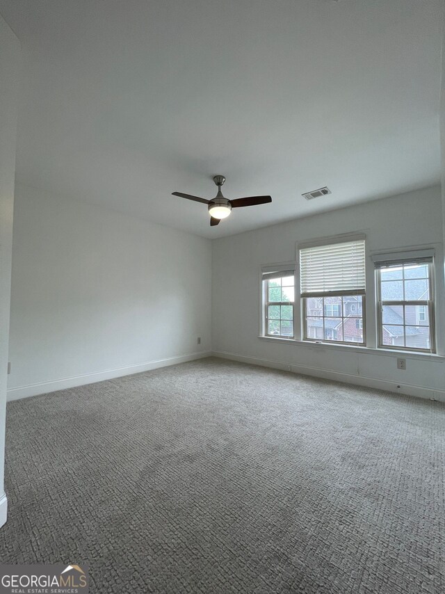 5928 Cobblestone Creek Cir, Mableton, GA 30126 - empty room featuring carpet flooring, visible vents, baseboards, and a ceiling fan