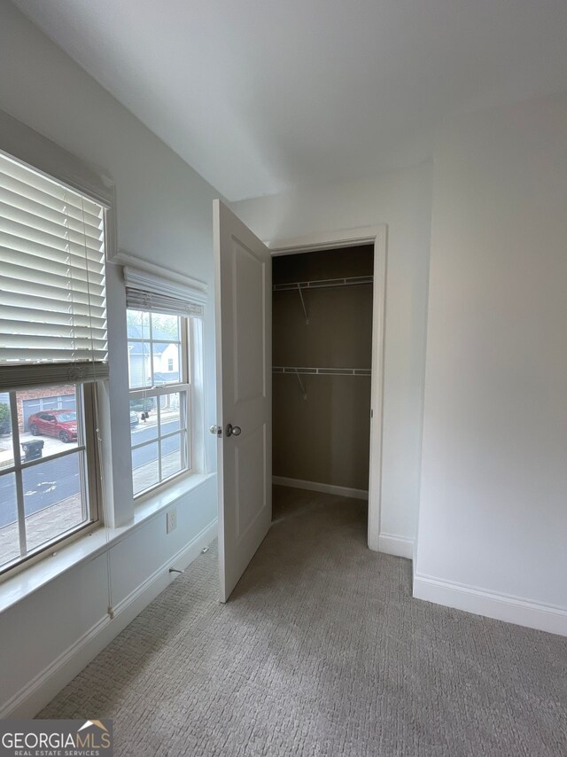 5928 Cobblestone Creek Cir, Mableton, GA 30126 - unfurnished bedroom featuring a closet, light colored carpet, and baseboards