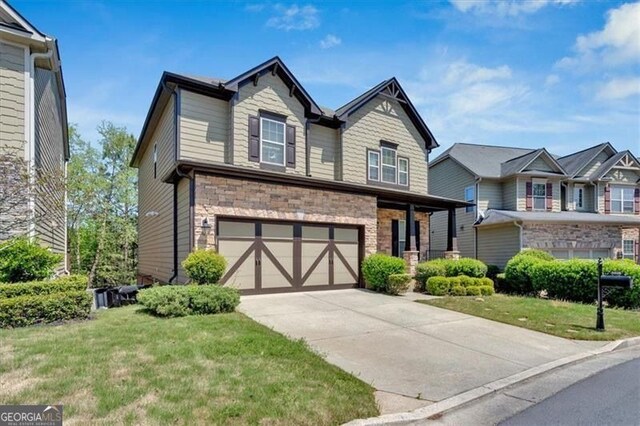 5928 Cobblestone Creek Cir, Mableton, GA 30126 - view of front facade with stone siding, a garage, a front yard, and concrete driveway