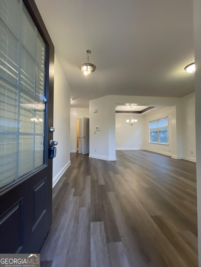 5928 Cobblestone Creek Cir, Mableton, GA 30126 - interior space featuring dark wood-type flooring, baseboards, and a notable chandelier