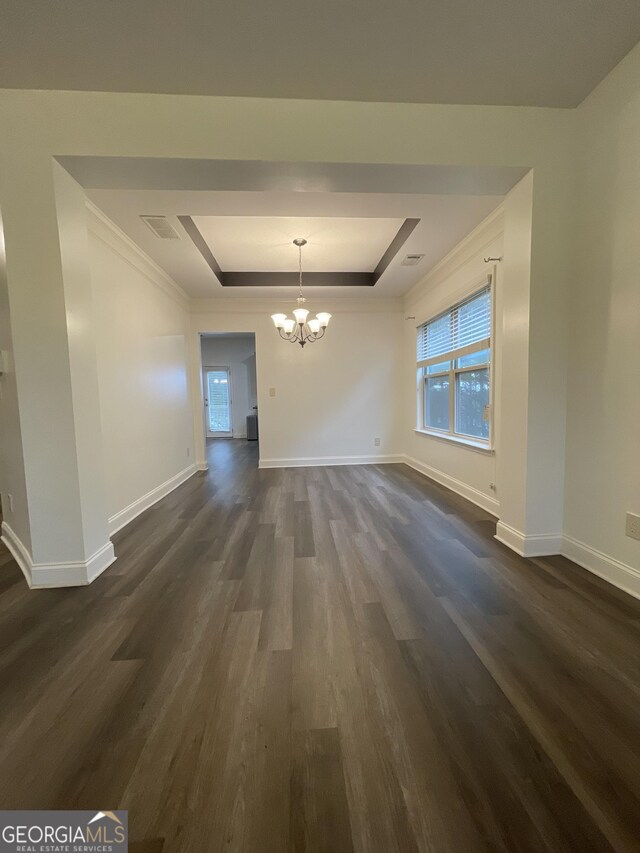 5928 Cobblestone Creek Cir, Mableton, GA 30126 - unfurnished dining area featuring crown molding, an inviting chandelier, a tray ceiling, visible vents, and dark wood-style flooring
