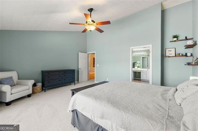 bedroom featuring carpet flooring, a textured ceiling, high vaulted ceiling, and a ceiling fan