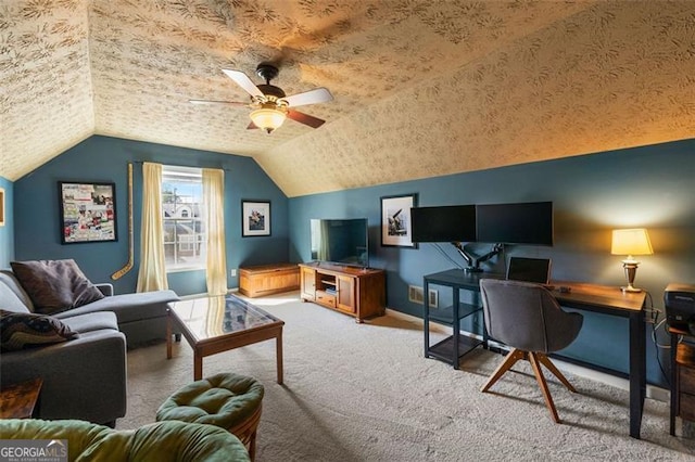 carpeted office space featuring ceiling fan, vaulted ceiling, baseboards, and a textured ceiling