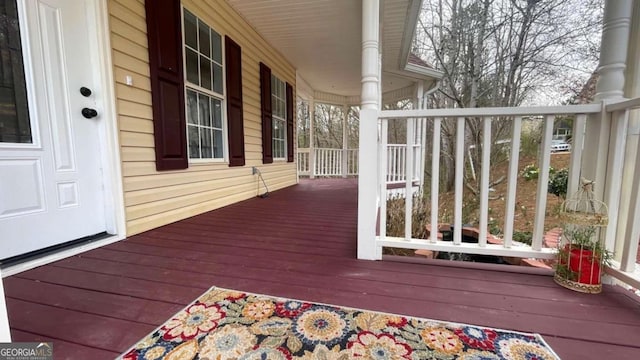 wooden terrace featuring a porch