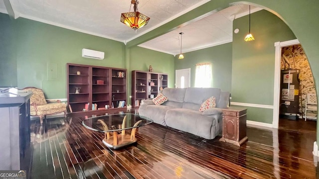 living room with baseboards, a wall mounted air conditioner, ornamental molding, water heater, and wood finished floors