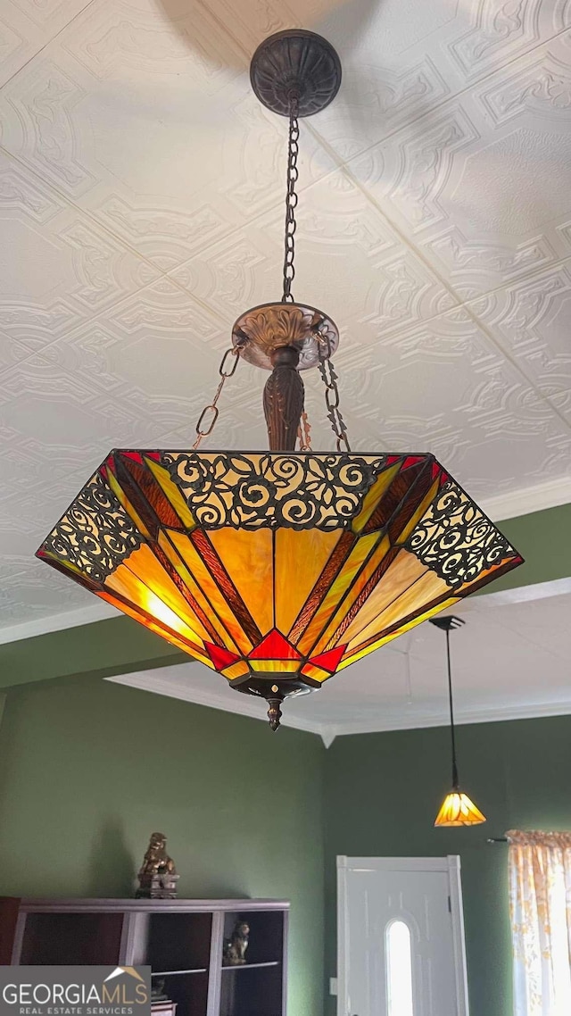 room details featuring crown molding and an ornate ceiling