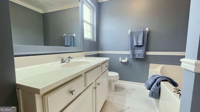 bathroom featuring vanity, a bath, baseboards, toilet, and marble finish floor