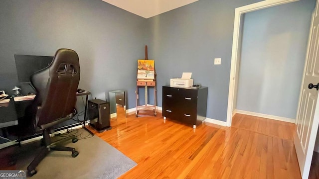 office featuring light wood-style flooring and baseboards