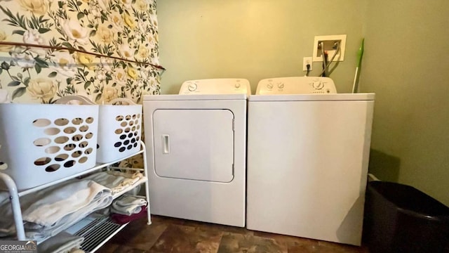 clothes washing area featuring laundry area and washing machine and dryer