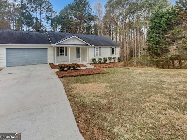 ranch-style house featuring a porch, concrete driveway, a front lawn, and an attached garage