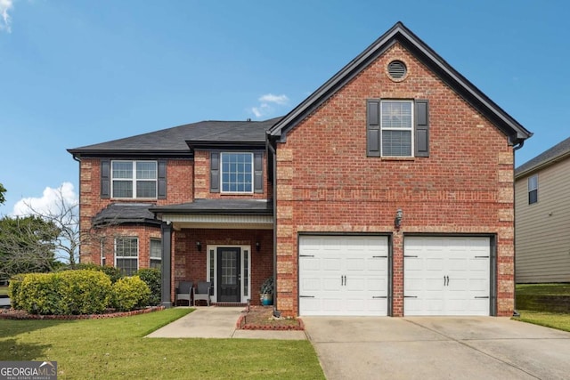 traditional-style house featuring a garage, a front yard, brick siding, and driveway