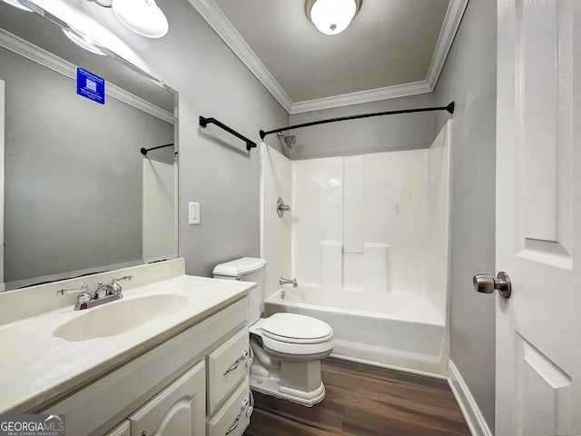 full bathroom featuring tub / shower combination, toilet, ornamental molding, wood finished floors, and vanity