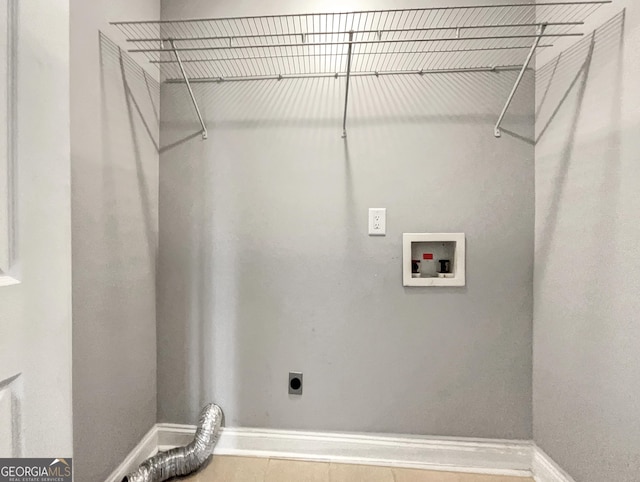 laundry room with laundry area, hookup for a washing machine, baseboards, and hookup for an electric dryer