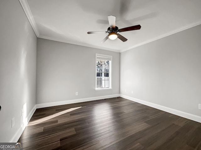 unfurnished room featuring ceiling fan, dark wood-type flooring, baseboards, and ornamental molding