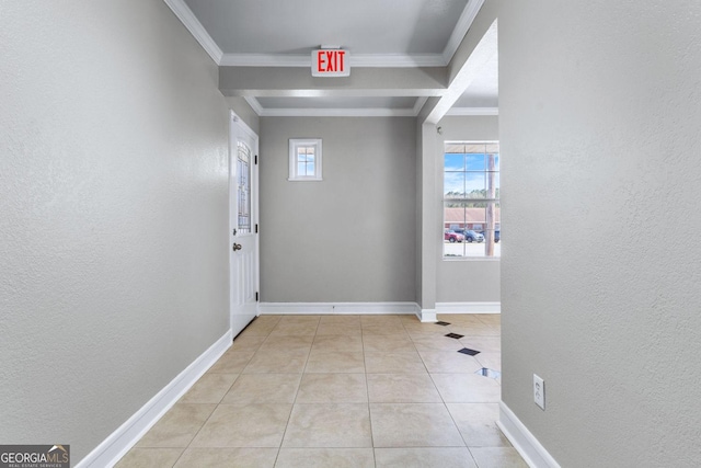 corridor with baseboards, a textured wall, and ornamental molding