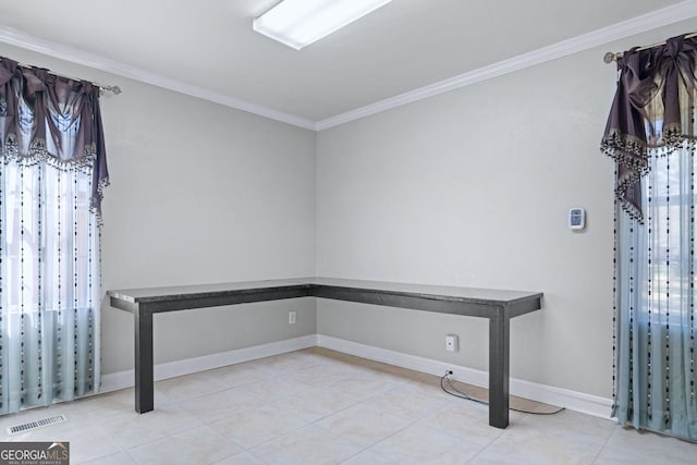 interior space featuring visible vents, crown molding, and baseboards