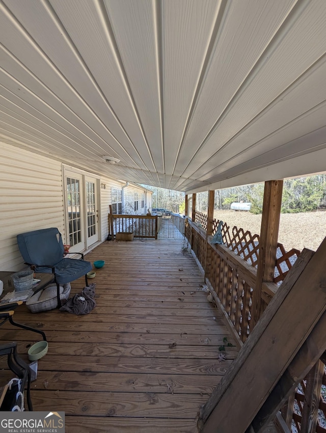 wooden deck featuring french doors