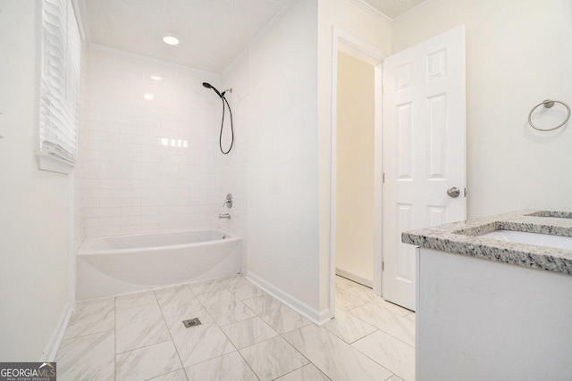 full bath featuring marble finish floor, baseboards, crown molding, and bathtub / shower combination