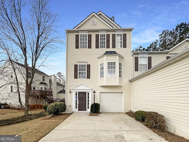 view of front facade featuring driveway and an attached garage