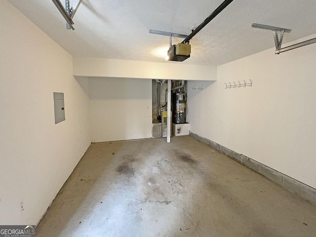 garage featuring heating unit, a garage door opener, and water heater