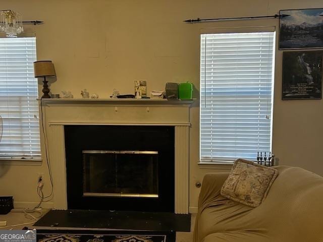 interior space with a glass covered fireplace