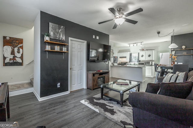 living room with baseboards, a toaster, dark wood-style flooring, ceiling fan, and stairs