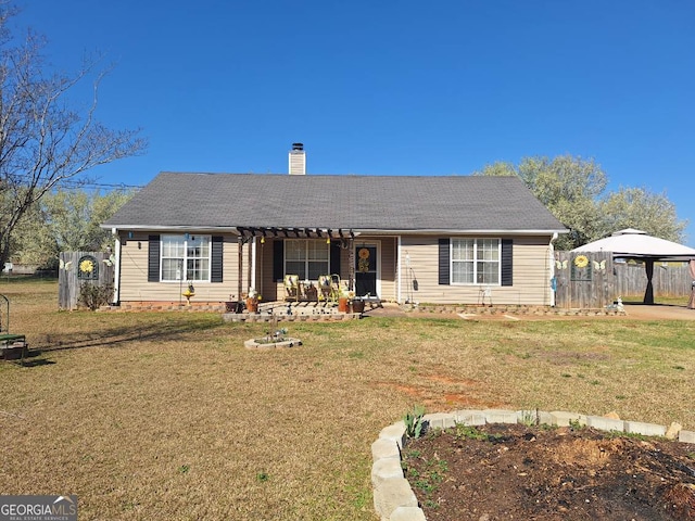 ranch-style home with a patio, fence, a chimney, a gazebo, and a front lawn