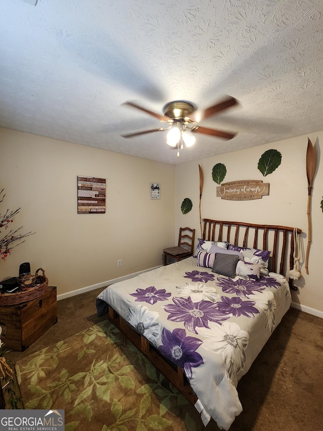 bedroom with a ceiling fan, carpet, baseboards, and a textured ceiling