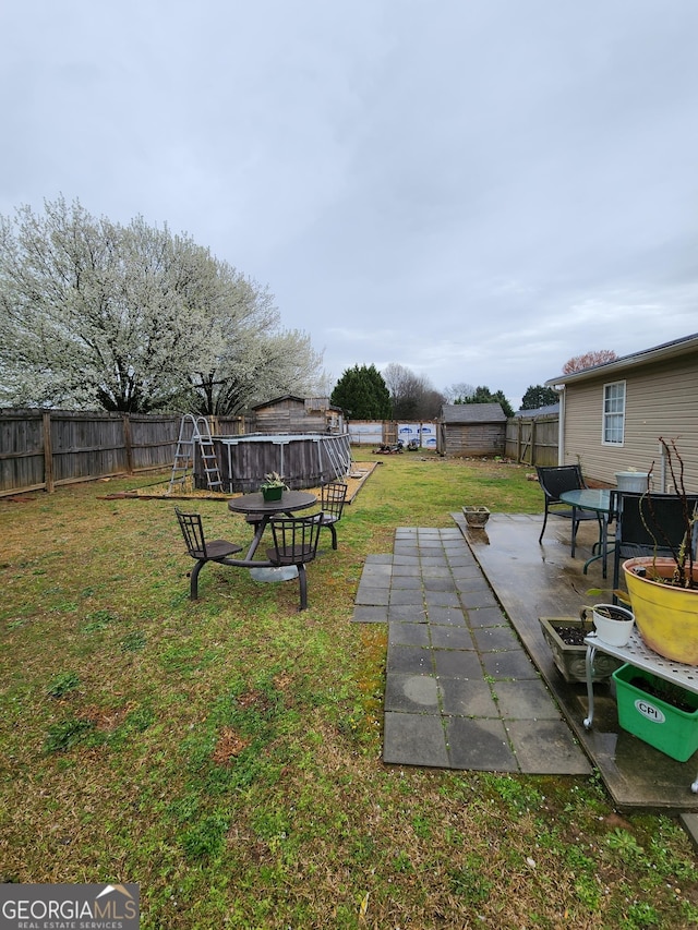 view of yard with a patio and a fenced backyard