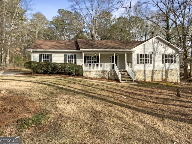 single story home featuring a porch and crawl space