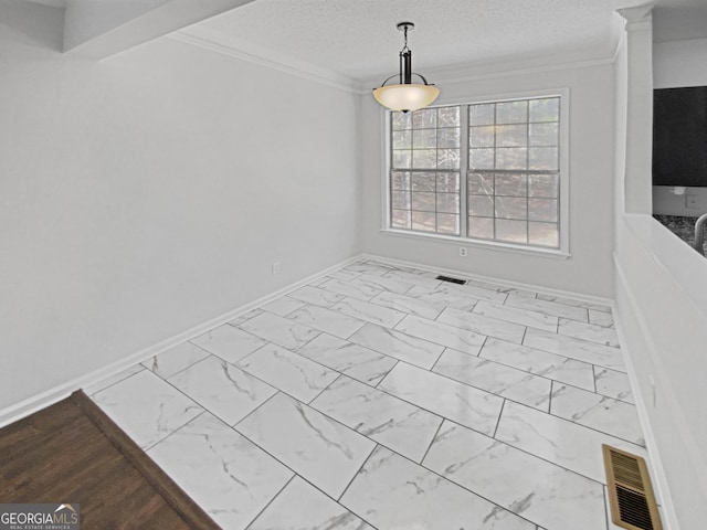 unfurnished dining area featuring visible vents, marble finish floor, a textured ceiling, and ornamental molding