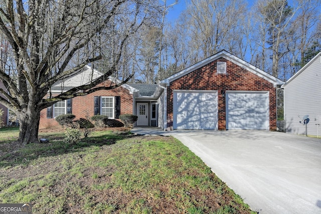 single story home with brick siding, driveway, a front yard, and a garage