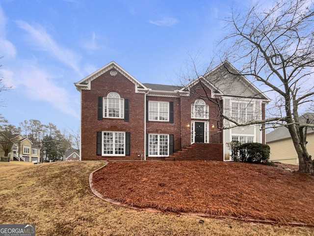 view of front of home with brick siding