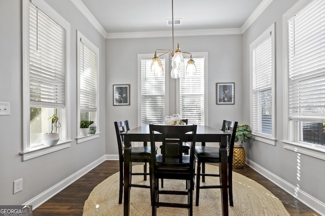 dining space with dark wood-style floors, visible vents, baseboards, and ornamental molding