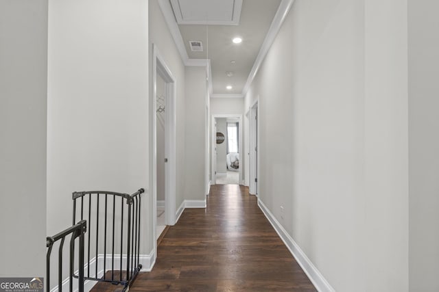 hall with ornamental molding, wood finished floors, recessed lighting, baseboards, and attic access