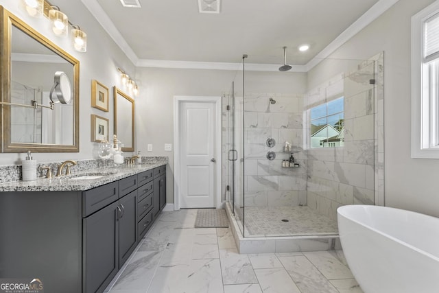 bathroom featuring a shower stall, a freestanding bath, ornamental molding, marble finish floor, and a sink