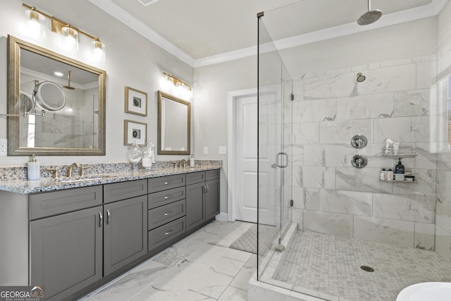 full bathroom with a sink, a shower stall, marble finish floor, and ornamental molding