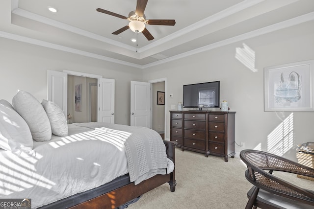 bedroom with a raised ceiling, crown molding, recessed lighting, and light colored carpet