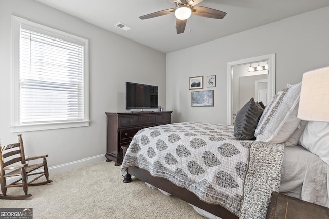 bedroom featuring a ceiling fan, carpet flooring, baseboards, and visible vents