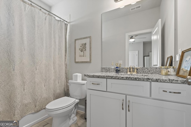 bathroom with visible vents, curtained shower, toilet, and vanity