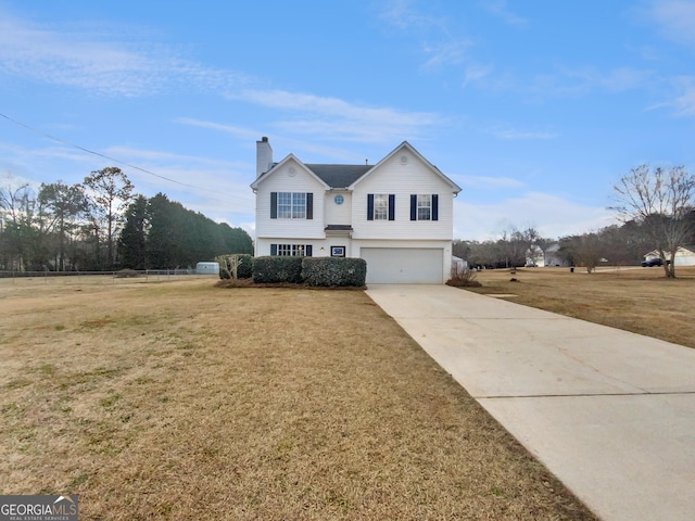 traditional-style house featuring a front yard, a garage, driveway, and a chimney